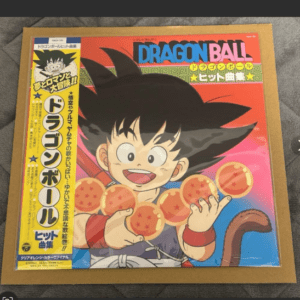 Colorful Dragon Ball poster featuring a smiling young Goku holding seven orange Dragon Balls with the logo at the top against a bright background.