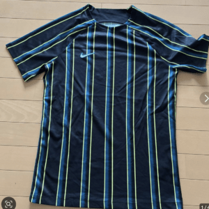 Dark navy athletic shirt with neon vertical stripes and a light blue Nike swoosh on the chest, short sleeves.