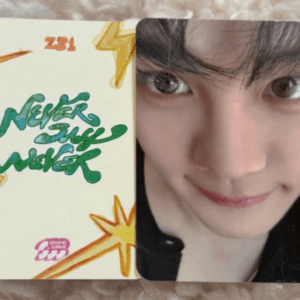 Split image: left side shows 'Never Say Never' graffiti-style lettering with yellow star doodles; right side a close-up portrait of a smiling young person with dark hair. delivery context uncertain.