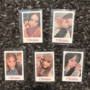 Six Polaroid-style photos of young women making claw poses on a dark carpet, each card labeled 'Club Icarus'.
