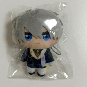 Small plush toy figure with gray hair and blue eyes, wearing a dark blue and white outfit, sealed in clear plastic packaging