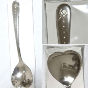 Long silver serving spoon with diamond-shaped pattern along the handle, photographed in packaging from multiple angles.
