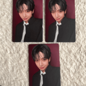 Three portrait photo cards showing a young man with dark hair, wearing a black blazer and white shirt, against a burgundy background; two cards on top, one at bottom, all showing the same image.