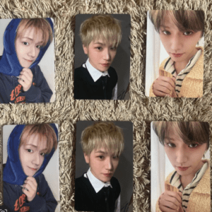 Six photo prints of a young man in different outfits arranged on a beige carpet.