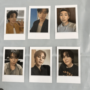 Polaroid-style portrait of a person in a mustard jacket making a peace sign, top-left. It’s one of six photos on a gray background, arranged in two rows of three?
