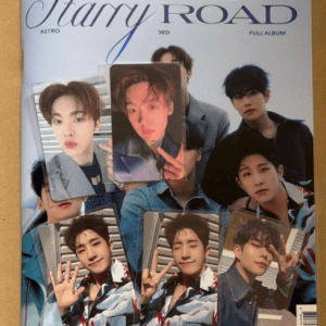 Album cover for Drive to the Starry Road featuring group members and scattered fan photo cards on a blue background.