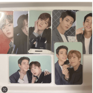 Set of six glossy portrait cards featuring young male models posing in suits and casual wear, arranged on a shelf.