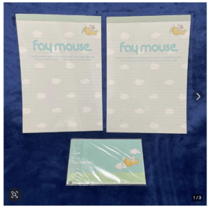 Two pale notebooks with cloud pattern and 'Fay Mouse' branding, plus a matching boxed set on a blue background.