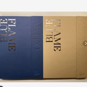 Row of four hardcover boxes in blue and tan tones with large embossed vertical text along the spines (BLUE/ASTRO).
