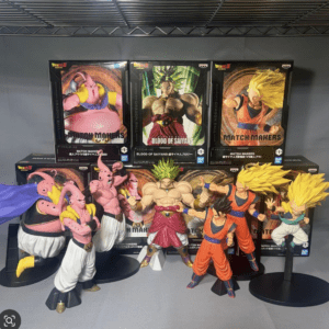 Dragon Ball Z collectibles arranged on a shelf, with boxed Match Makers figures in the background and several character figures posed in front.  Articulos Japan (Post Box Japan)