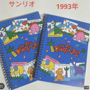 Two blue spiral-bound notebooks feature colorful cartoon dinosaurs and the bold slogan 'We Are Dinosaurs' on the cover, with '1993' written above in red text on the image (caption).
