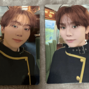 Two portrait photos of a young man with brown hair in a black uniform with gold trim (two cards).