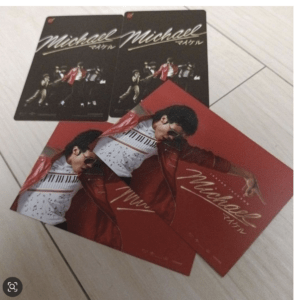 Michael Jackson-themed set: two dark collectible cards with MJ and dancers, plus a red album sleeve showing MJ in a red jacket and sunglasses.