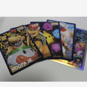 Fanned deck of Mario character trading cards, prominently featuring Koopa Jr. with the text KOOPA JR. and numbers 001–010.