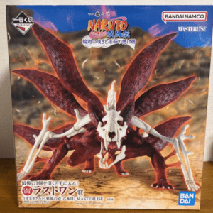 Boxed Naruto Masterlise figure showing a red dragon-like creature with skeletal white bones and Bandai Namco branding on the packaging
