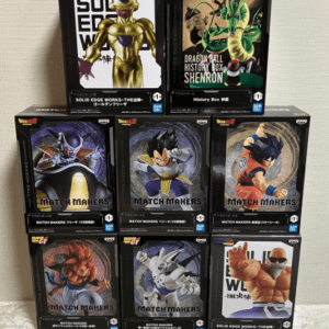 Stacked collection of Dragon Ball Match Makers action figure boxes on a shelf, showing various characters in black packaging.