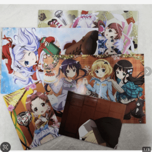 Collection of colorful anime posters spread on a light floor, featuring festive outfits and chibi-style characters.  Articulos Japan (Post Box Japan)