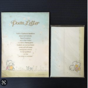 Pastel blue Poem Letter card with dandelions and小girl and bunny illustrations, left item; a matching pale card in plastic sleeve on the right.