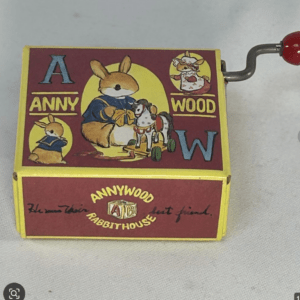 Vintage Annywood Rabbit House puzzle box with red and yellow artwork featuring a cartoon rabbit and a toy horse, labeled 'A' and 'W'.