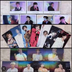Multiple K-pop idol posters and photo cards laid out in rows on a beige carpet; colorful outfits and stage photos across the collection.