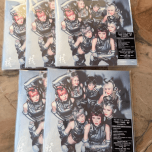 Box set covers featuring a six-member girl group in metallic outfits, arranged in a pyramid pose.