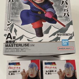 Box art of a Dragon Ball figure: a ninja-like character in blue with a red staff, mountains backdrop, Bandai logos, and Japanese text.