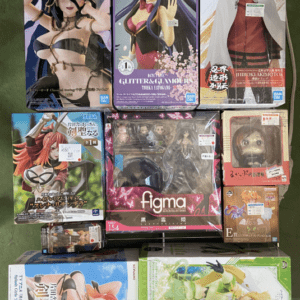 Display of multiple boxed anime figures on a store rack, with colorful character art on each box.