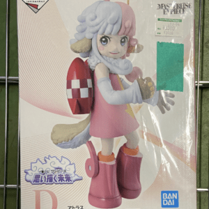 Boxed plastic-model figure of a girl with blue and pink hair, wearing a pink dress and orange boots, with a red rocket backpack, wrapped in clear plastic and displayed for sale. Branding shows Bandai Namco and One Piece licensing.