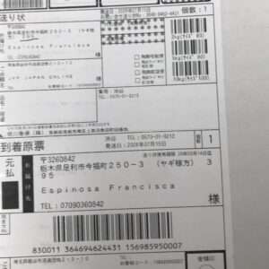 Delivery label with recipient Espinosa Francisca, address in Tochigi, Japan, phone number, and a barcode.