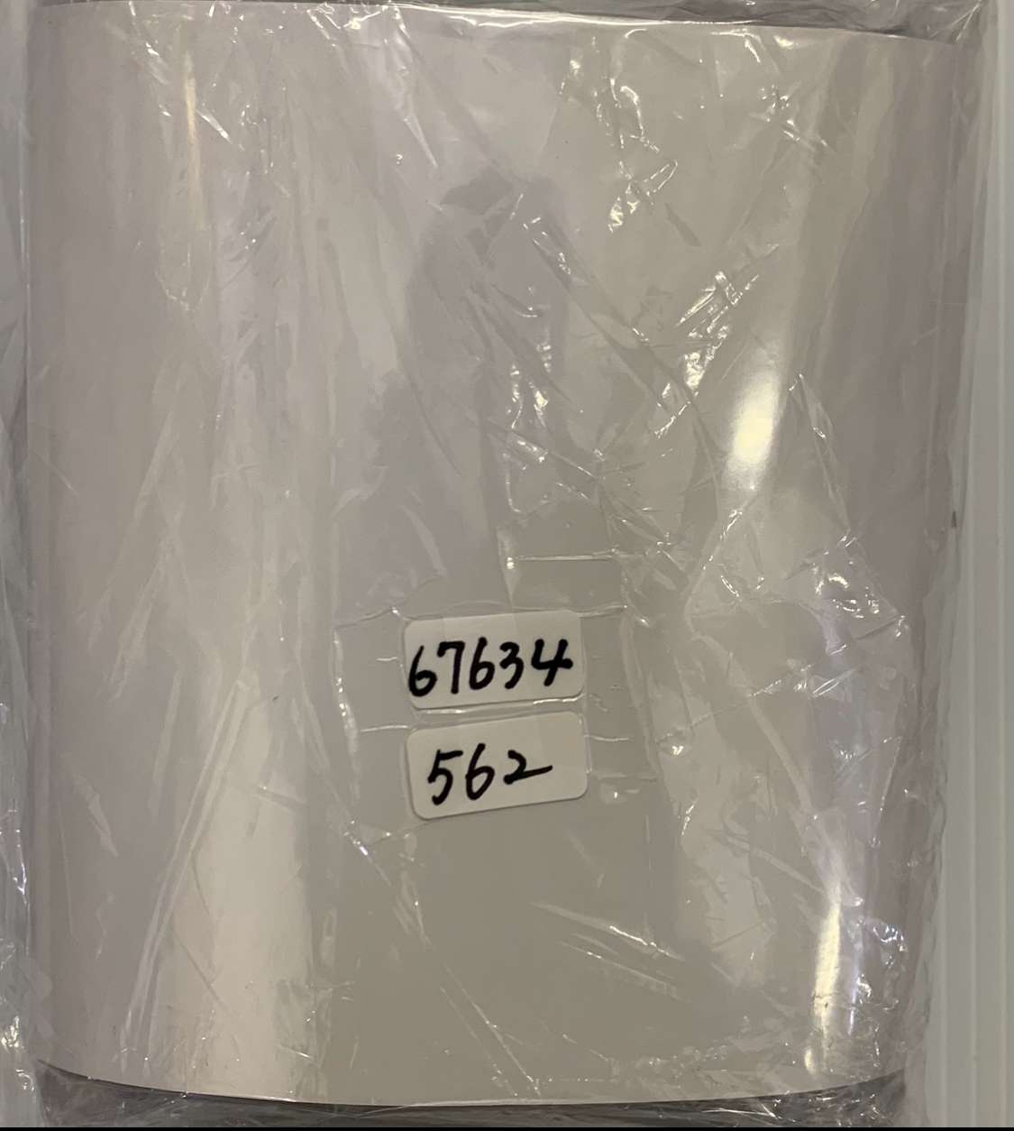 Img_2575 - Articulos Japan (post Box Japan) White cylindrical item wrapped in clear plastic film with two inventory labels reading 67634 and 562. Articulos Japan (Post Box Japan)