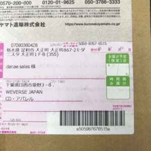 Japanese shipping label on a cardboard box, showing recipient 'danae salas 様', address in Tochigi Prefecture, WEVERSE JAPAN, and a large barcode at the bottom.