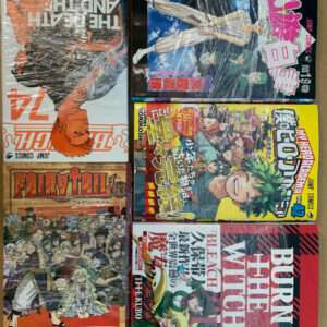 Six manga volumes in plastic wrap laid out on a brown surface, each with colorful illustrated covers and Japanese text, arranged in a 2x3 grid.