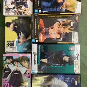 Boxed anime figures on a metal shelf, including Konami Equal-Arts character on top-left and Dragon Ball Z Grandista boxes nearby
