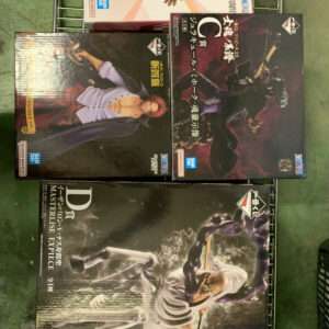 Boxed anime figure sets on a wire shelf, showing several Banpresto Masterlise boxes with colorful character art.