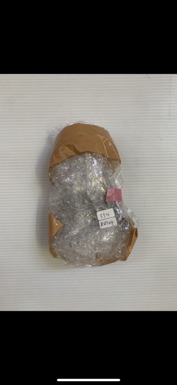 Img_2838 2 - Articulos Japan (post Box Japan) Small item wrapped in bubble wrap and brown packing paper, secured with pink tape, ready for shipping. Articulos Japan (Post Box Japan)