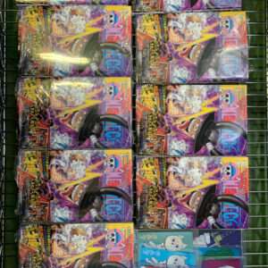 Row of identical colorful manga boxes arranged in a grid on a metal rack, each featuring a purple-yellow design and bold text.
