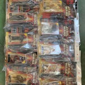 Rows of Star Wars action figure boxes in plastic packaging on a store display rack, filling the shelves.