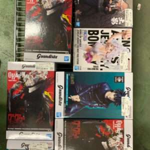 Row of boxed anime figures on a metal rack, featuring Dragon Ball and other character boxes.