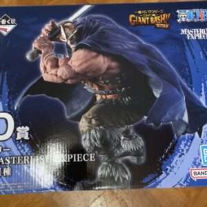 Box art for a One Piece Masterlise statue, showing a muscular swordsman in a blue cape, ready for battle; includes Bandai Namco logo and D prize text.