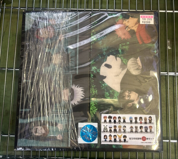 Img_e0721 - Articulos Japan (post Box Japan) Plastic-wrapped anime poster showing a forest scene with several characters; price tag ¥8500 in the top-right corner. A sheet of small chibi figures is attached in the bottom-right. Articulos Japan (Post Box Japan)