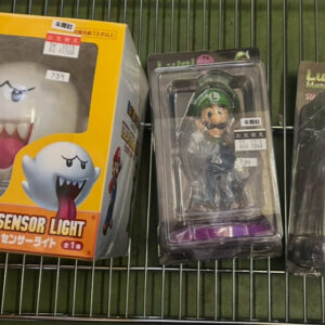 Boxed Teresa Sensor Light from Super Mario, showing a white Boo ghost with a wide open mouth on a bright yellow package.  Articulos Japan (Post Box Japan)