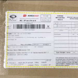 K-Packet shipping label from Korea Post attached to a brown cardboard box with a barcode and tracking number