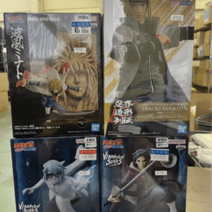 Stack of Naruto Vibation Stars figure boxes on a shelf, featuring Naruto panels and Itachi/Uchiha Kabuto boxes across two rows