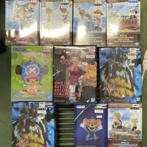 Boxed anime figures on a display rack, showing various character figures and packaging.