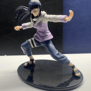 Anime figurine of a girl in a lavender jacket and blue pants, crouched in a dynamic fighting pose on a black circular base, with long dark hair flowing behind.