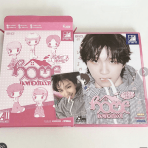 Pink packaging featuring cute chibi characters with 'Sweet Home' text and a close-up photo of a young man in a hoodie on the right side.