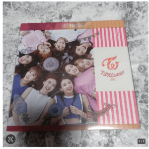 TWICEcoaster Lane 1 product box with a group photo of smiling girls and pink striped design.