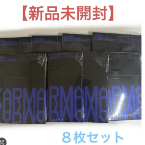 Eight unopened black boxes with blue KARMA branding, arranged in a row; Japanese text above reads '新品未開封' (brand-new, unopened) and below '8枚セット' (8-piece set).