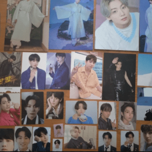 Collage of many portrait photos of a young man in various outfits arranged on a wooden background.