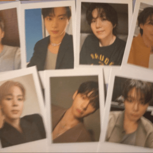 Collage of seven Polaroid-style portrait photos of young men posing for the camera.